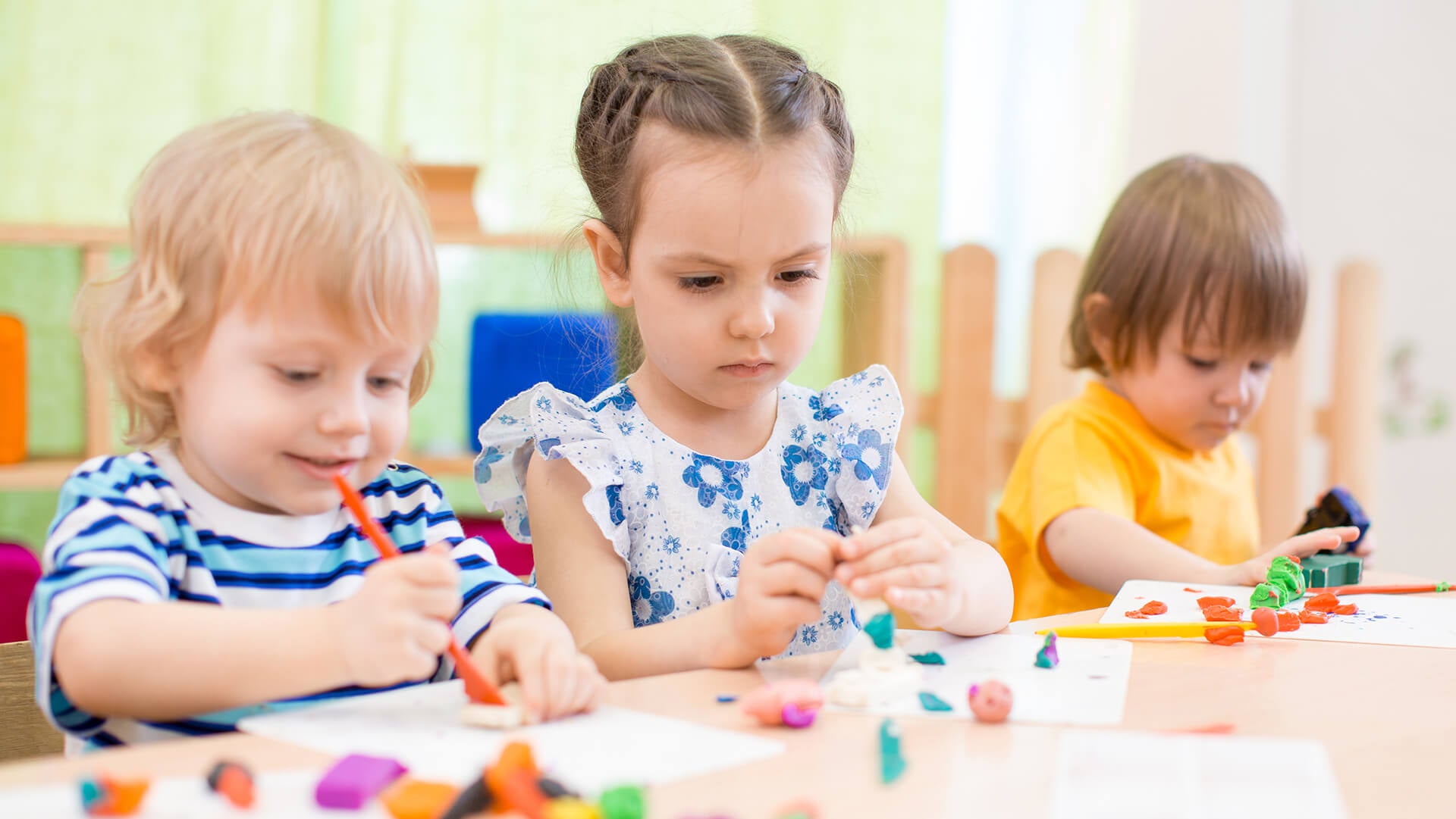 Kids are playing with clay