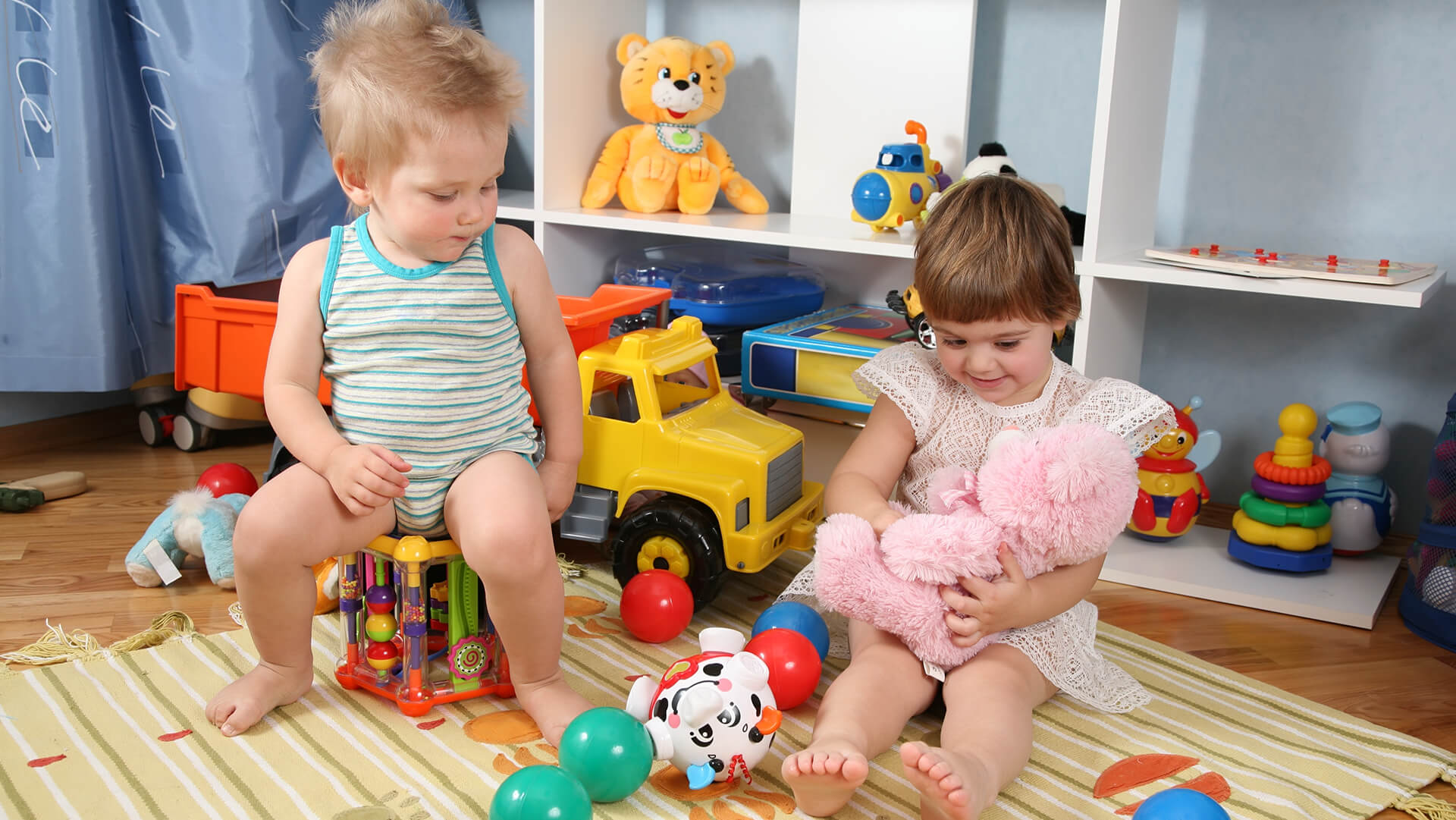 Cute baby playing with toys