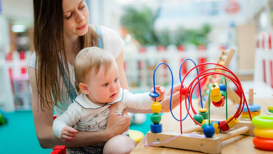 Boy baby playing abacus